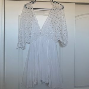 White flowy dress. By Free People size small. Dress is lined.